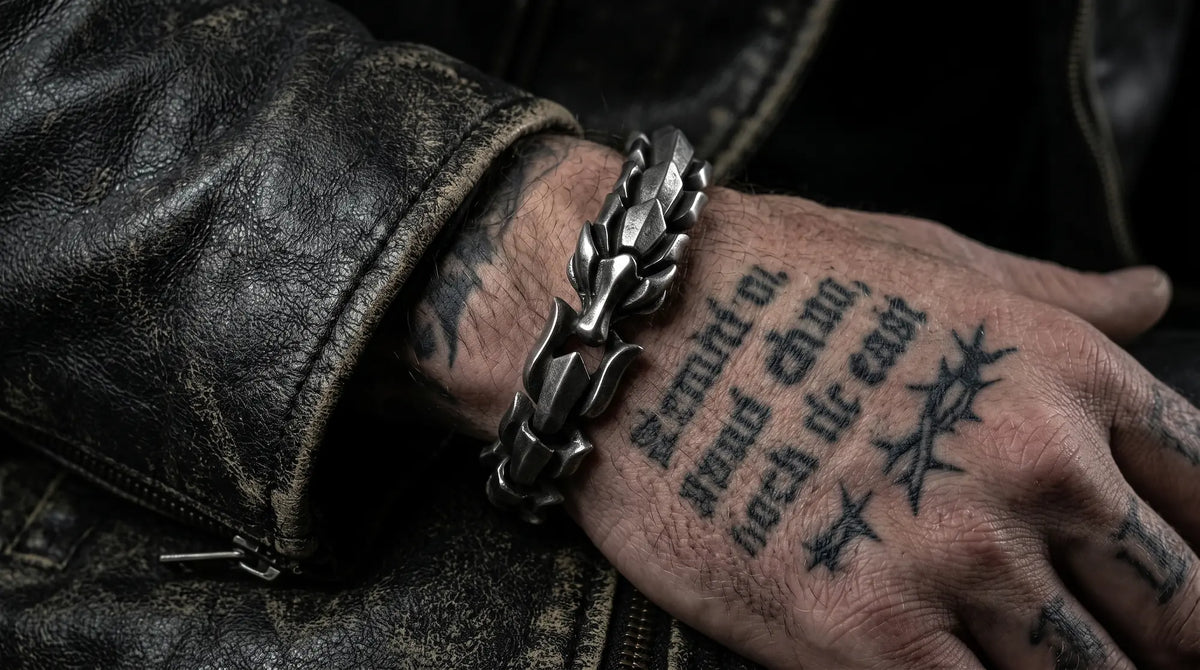 Dragon scale armor 316L stainless steel bracelet worn on a tattooed wrist with a black leather jacket