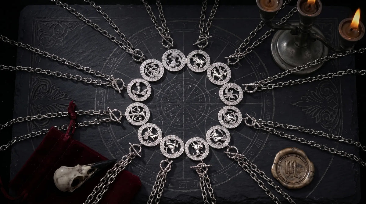 Twelve zodiac sign necklaces arranged in a circle on a dark astrology chart with candles