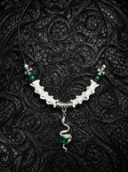 Basilisk Jewel Snake Bone Necklace, white snake vertebrae necklace with green beads and coiled serpent pendant