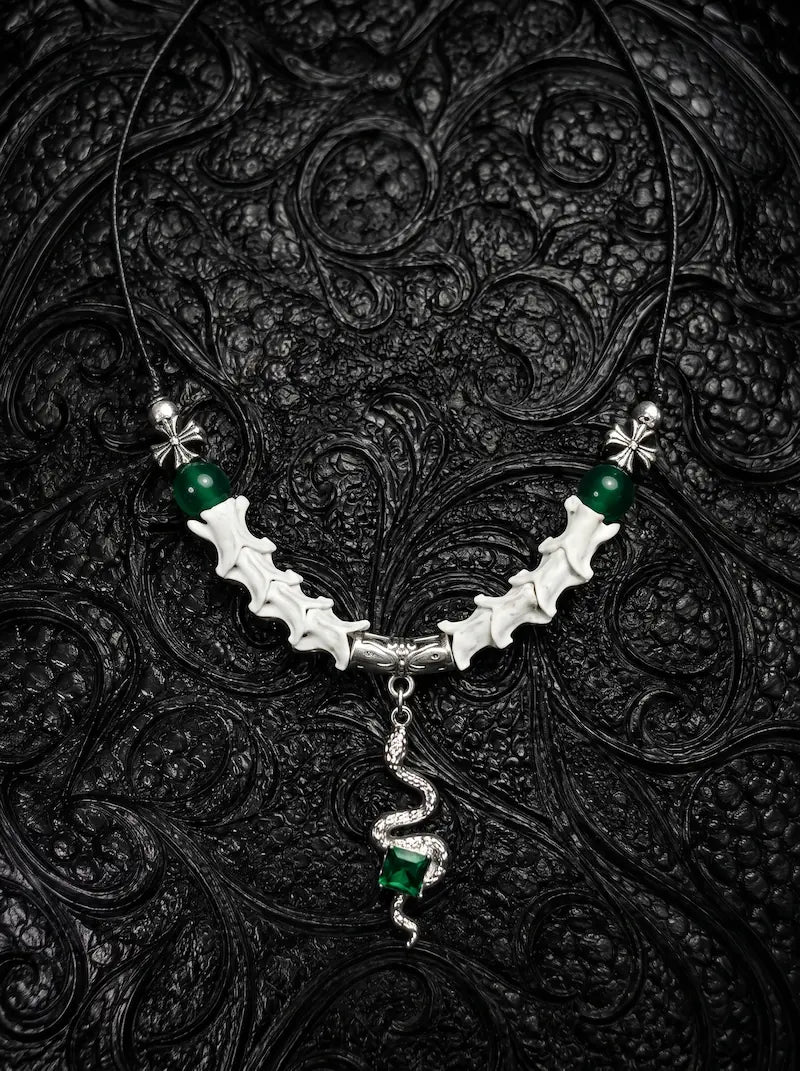 Basilisk Jewel Snake Bone Necklace, white snake vertebrae necklace with green beads and coiled serpent pendant