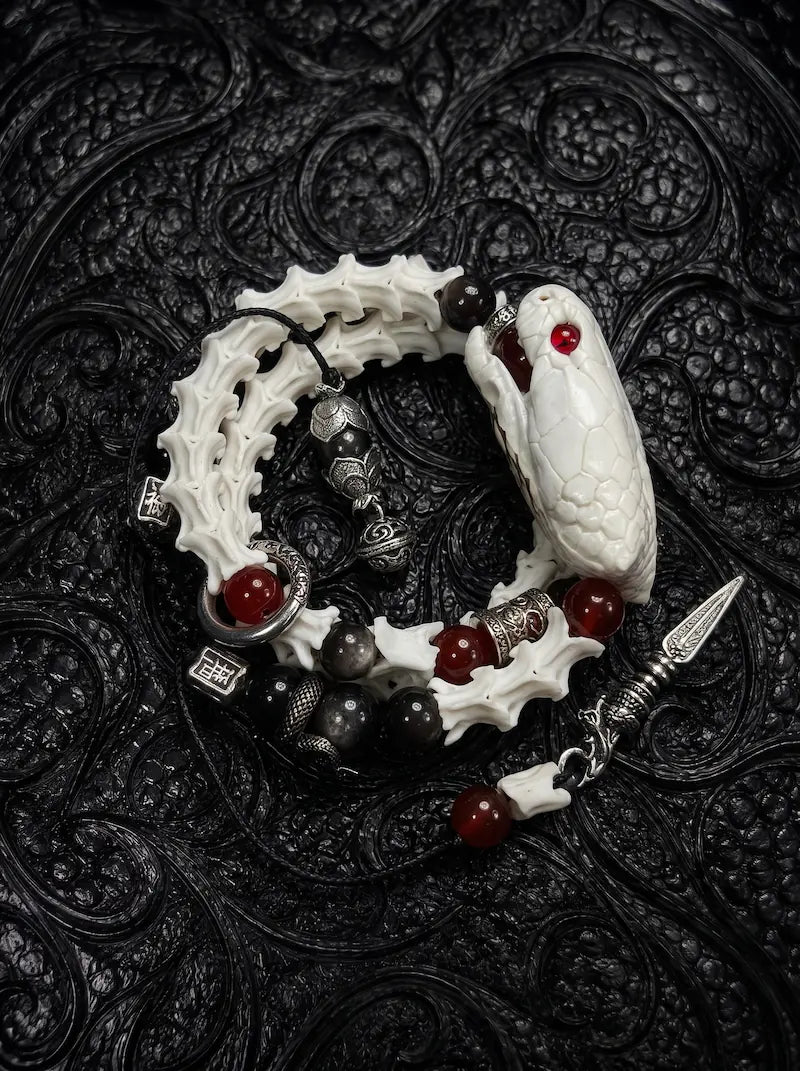 Bloodgaze Snake Bone Bracelet, coiled pale vertebrae bracelet with preserved snake head and deep red bead accents