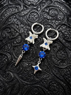 Blue Shard Snake Bone Earrings, pair of pale bone earrings with royal blue beads, star charms and pointed drops