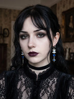 Blue Shard Snake Bone Earrings, front portrait displaying the matching blue bead and star drop earrings