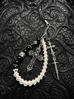 Cathedral Relic Snake Bone Keychain, loop of pale snake vertebrae with metal cross charms, dark beads and clip