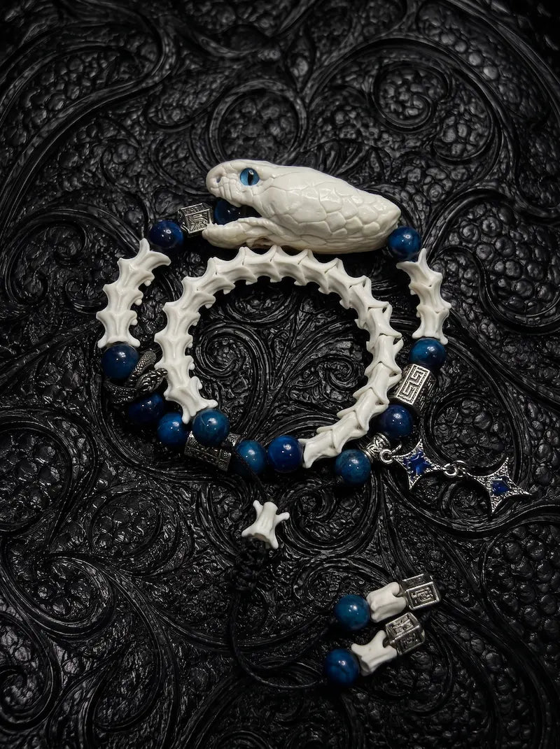 Cobalt Batwing Snake Bone Bracelet, pale preserved snake head and vertebrae bracelet with vivid cobalt-blue beads