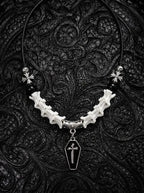 Coffin Oath Snake Bone Necklace, pale snake vertebrae necklace with dark beads and a coffin-shaped metal pendant