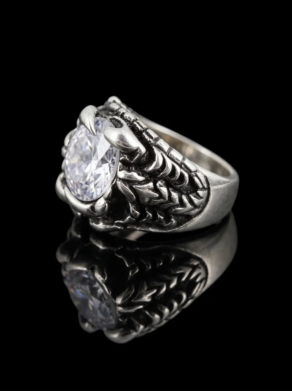 Side view of Dragon Talon Zircon Ring with a large clear gemstone and sculpted gothic claw details
