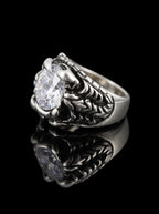 Side view of Dragon Talon Zircon Ring with a large clear gemstone and sculpted gothic claw details