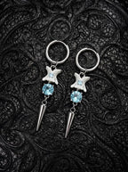 Glacial Spike Snake Bone Earrings, pair of pale vertebrae earrings with icy blue beads, star ornaments and metal points