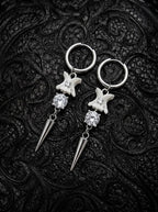 Glimmerthorn Snake Bone Earrings, pair of pale vertebrae drop earrings with silver-tone star details and pointed tips