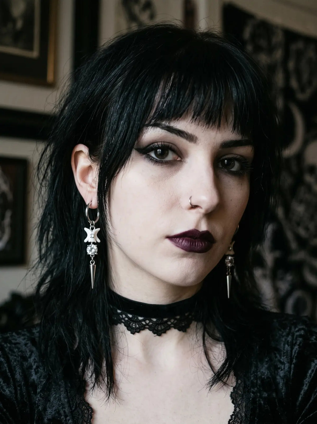 Glimmerthorn Snake Bone Earrings, front portrait wearing pale snake bone earrings with slim metal spike pendants