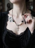 Gravecross Snake Bone Necklace, front close-up of dangling cross pendant and pale snake bone segments
