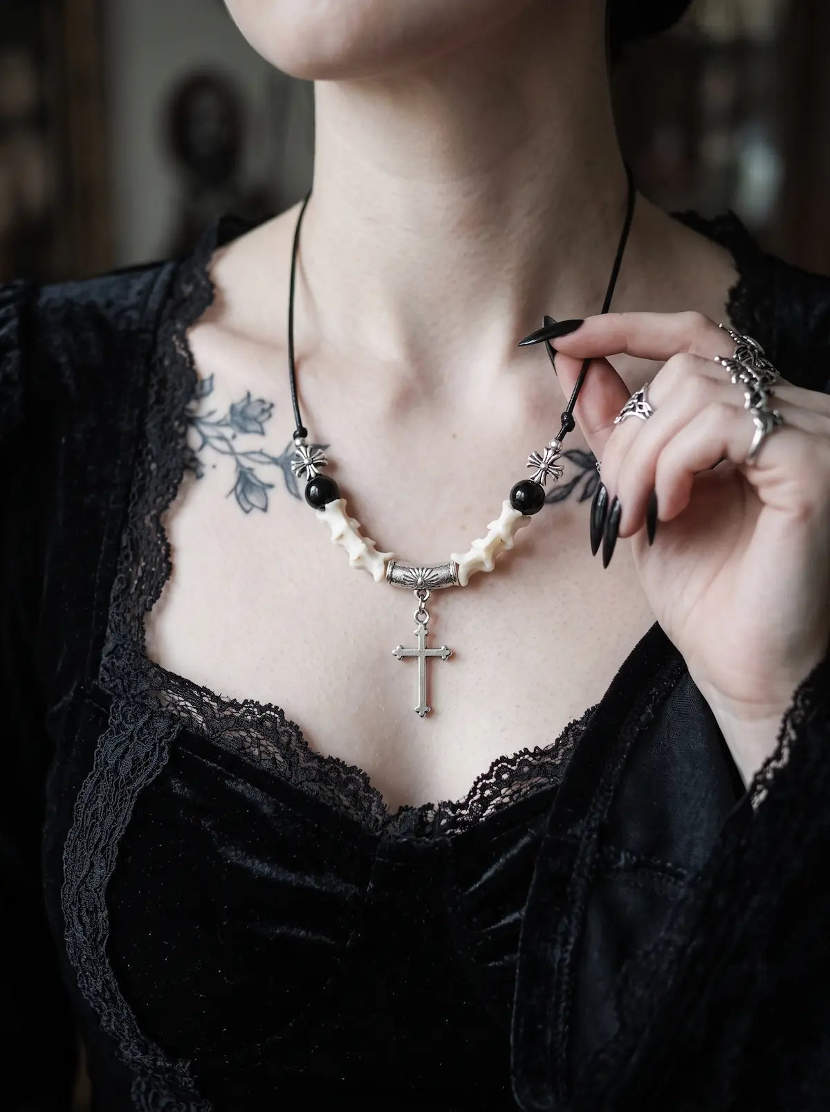 Gravecross Snake Bone Necklace, front close-up of dangling cross pendant and pale snake bone segments