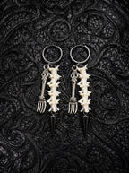 Gravefork Snake Bone Earrings, pair of white snake vertebrae earrings with antique silver-tone forked pendants