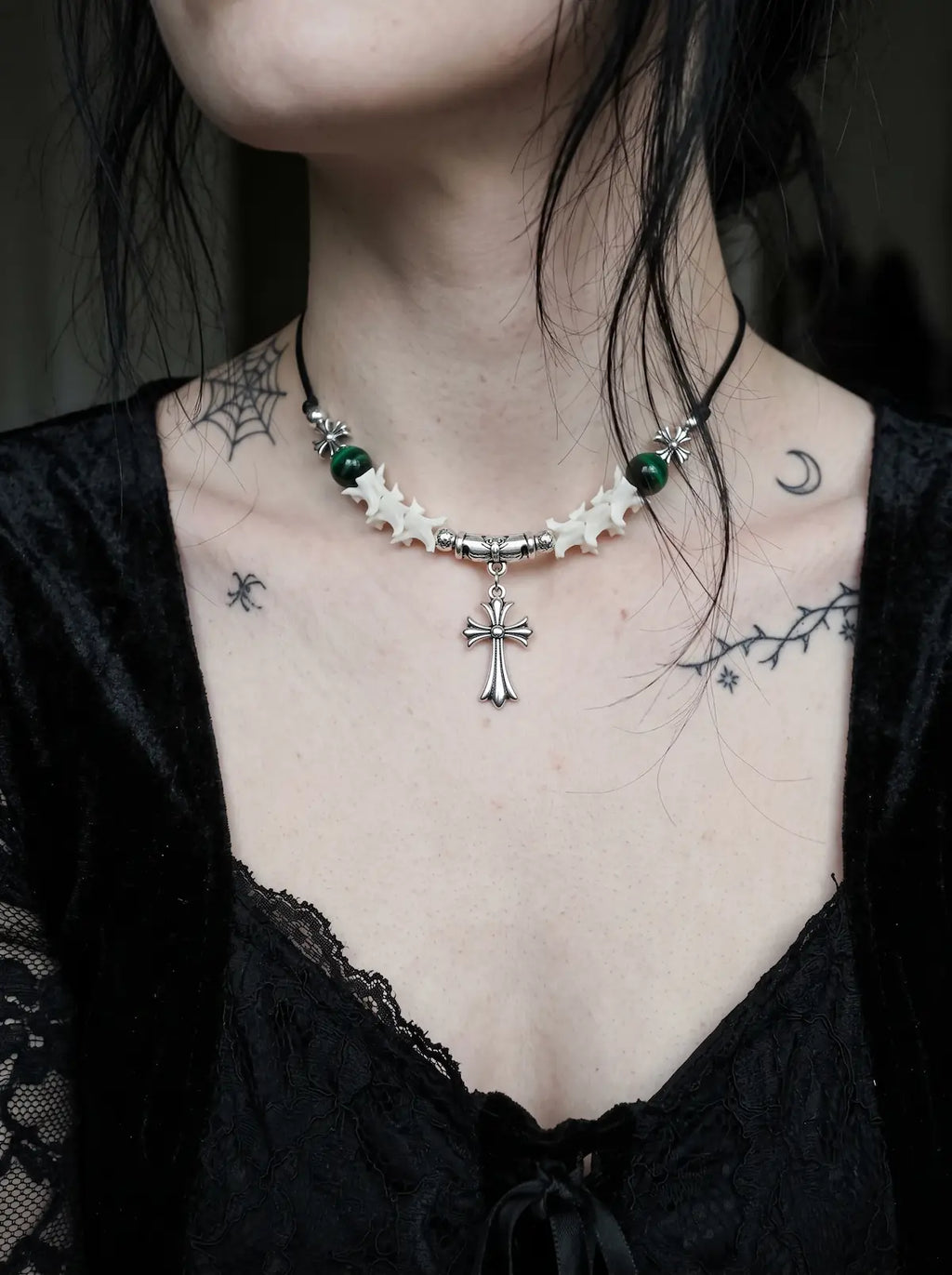 Greenveil Cross Snake Bone Necklace, white snake bone and green bead cross necklace worn above a black corset top