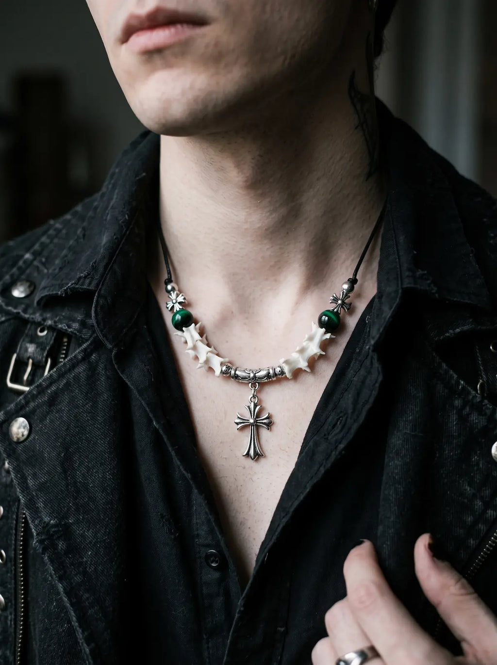Greenveil Cross Snake Bone Necklace, white vertebrae necklace with dark green bead accents worn at the collarbone