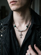 Greenveil Cross Snake Bone Necklace, white vertebrae necklace with dark green bead accents worn at the collarbone