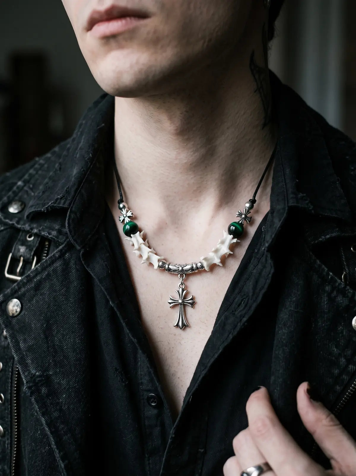 Greenveil Cross Snake Bone Necklace, white vertebrae necklace with dark green bead accents worn at the collarbone