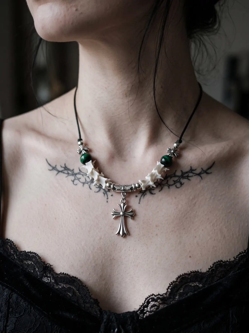 Greenveil Cross Snake Bone Necklace, front view of green bead and white bone necklace with ornate cross charm