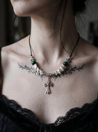 Greenveil Cross Snake Bone Necklace, front view of green bead and white bone necklace with ornate cross charm