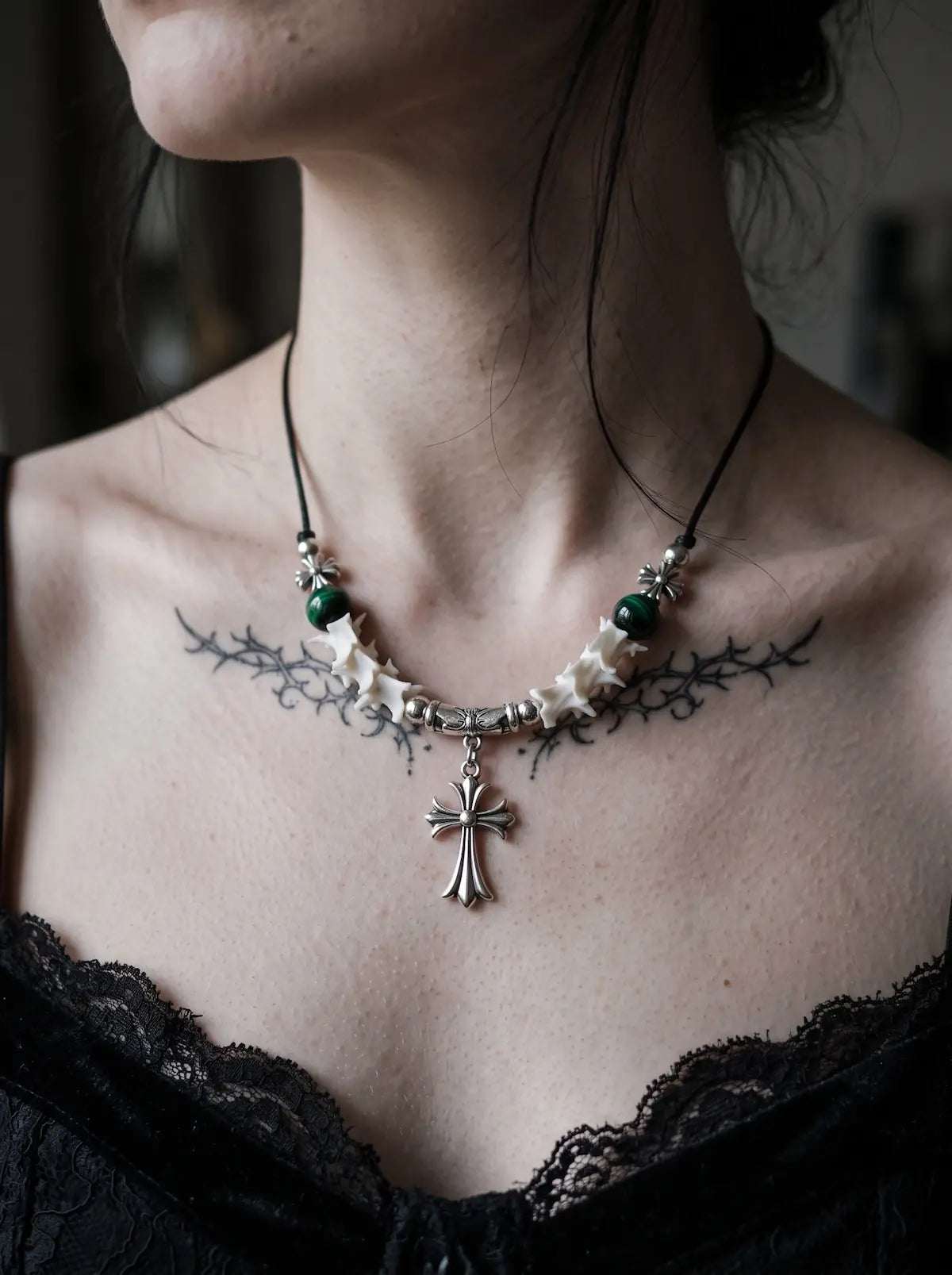 Greenveil Cross Snake Bone Necklace, front view of green bead and white bone necklace with ornate cross charm