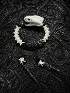 Jadefang Snake Bone Bracelet, preserved pale snake head bracelet with green beads and dangling metal charms