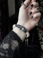 Kingshade Snake Bone Bracelet, close side wrist view showing dark snake head and pale bone beads