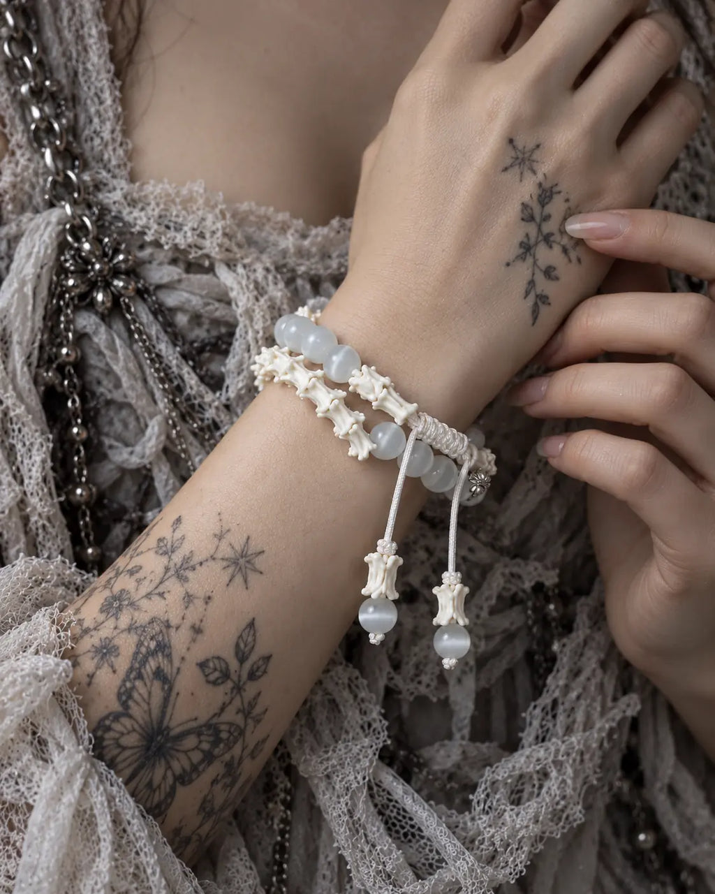 Close-up of Moonveil snake bone bracelet showing milky beads, white vertebrae and its braided sliding knot