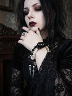 Nightreign Snake Bone Bracelet, model wearing a dark snake head bracelet while touching the chin