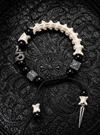 Obsidian Fang snake bone bracelet with black beads, a serpent accent and a silver-tone spike on black adjustable cords