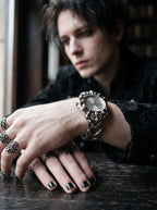 Razorclaw Gothic Watch, overlapping hands wearing the silver-dial gothic watch with ornate case details