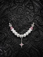 Roselight Snake Bone Necklace, white snake bone necklace with pink bead accents and a pointed star pendant