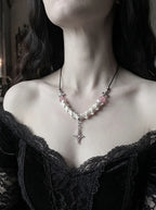 Roselight Snake Bone Necklace, front view of pink accented snake bone necklace and dangling pointed star