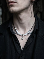 Seafoam Starfish Snake Bone Necklace, pale snake bone and starfish necklace worn above an open dark shirt