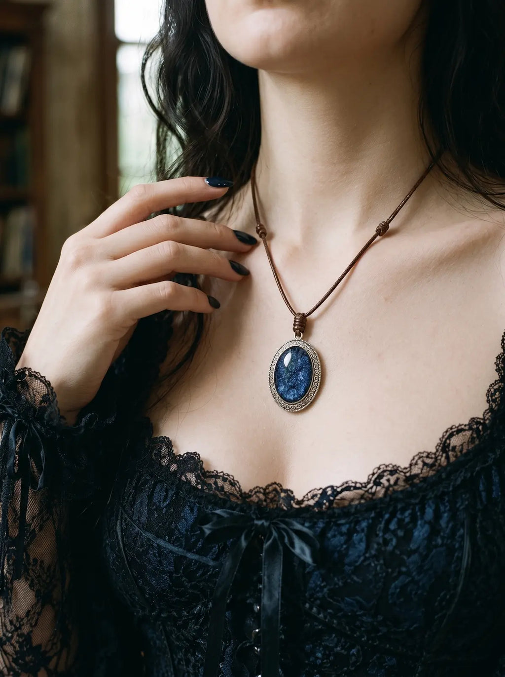Midnight Blue Serpent Relic snakeskin pendant worn above a blue and black lace top
