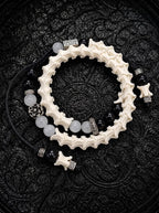 Smoky Rosette double-wrap snake bone bracelet with black and gray beads, a silver-tone flower and black cords
