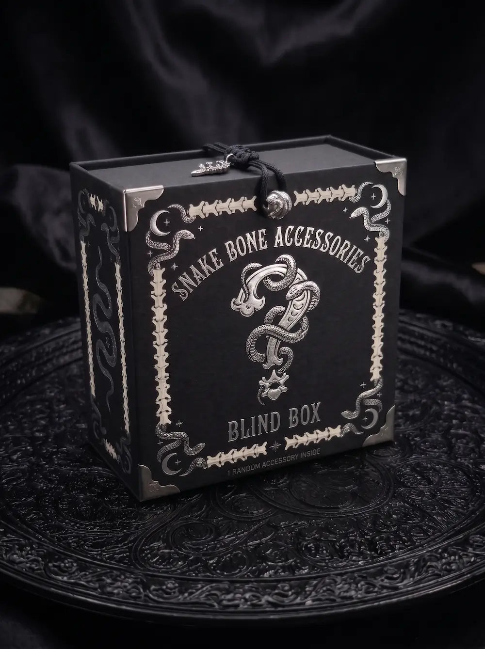 Snake Bone Accessories Mystery Box, black VALRSOUL Snake Bone Accessories mystery box with ornate silver print and question mark