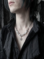 Snowbound Snake Bone Necklace, white snake bone snowflake necklace worn with an open charcoal shirt