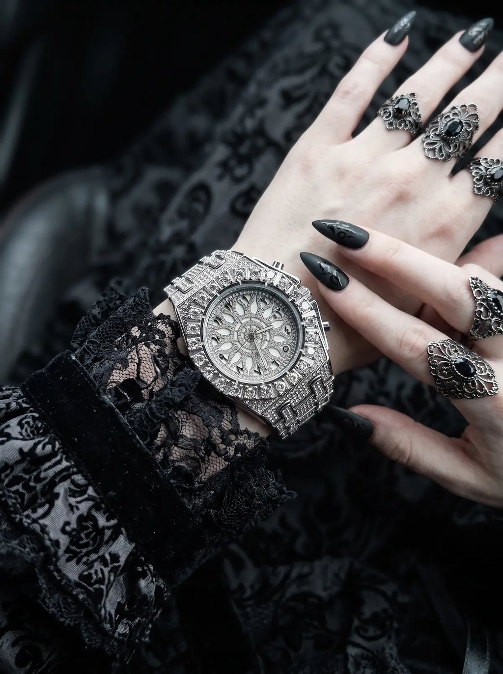 Solar Sigil Gothic Watch, silver watch with intricate dial worn beside black lace gloves and dark rings