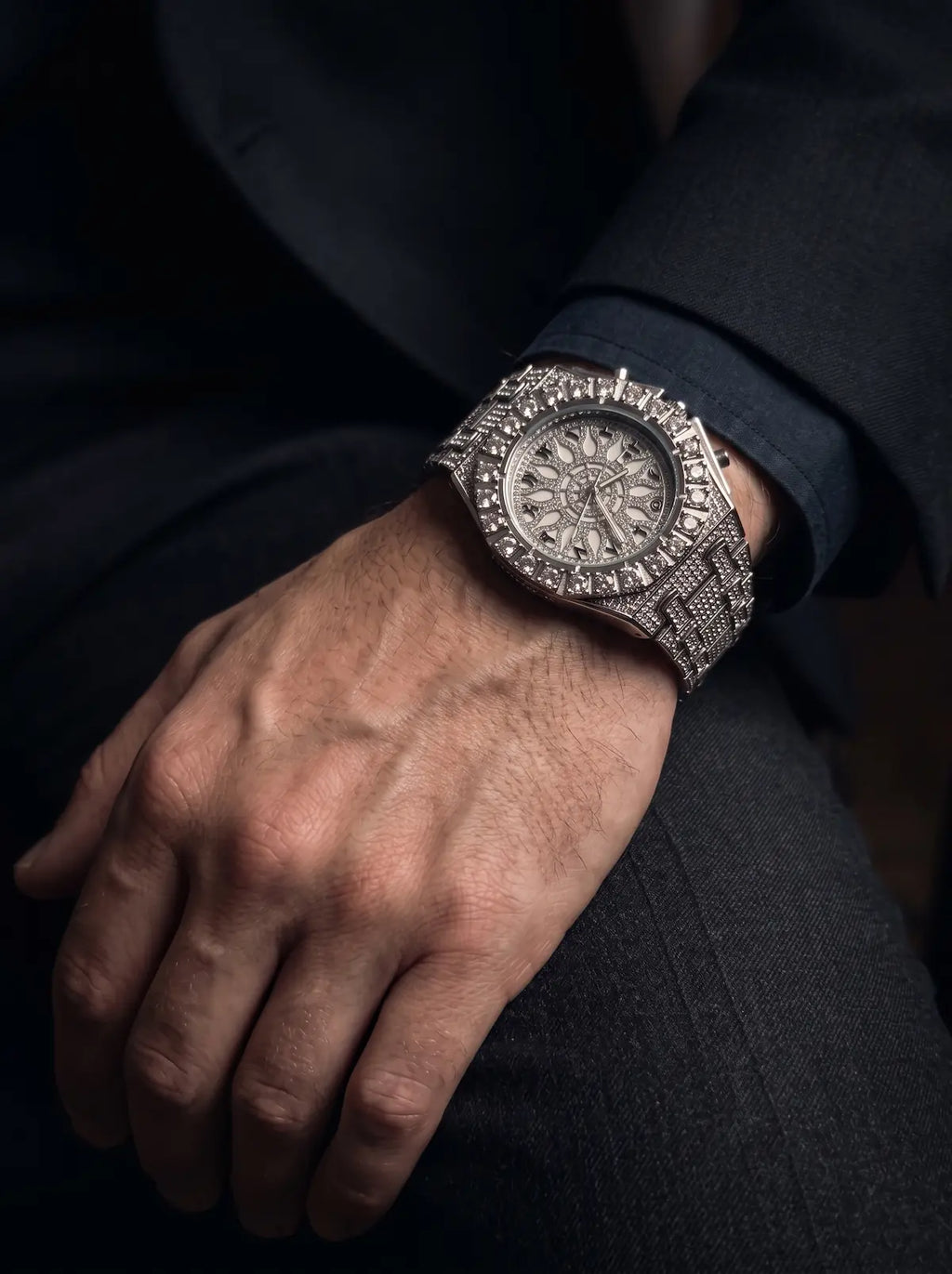 Solar Sigil Gothic Watch, bright silver sigil-dial watch worn on a hand against dark clothing