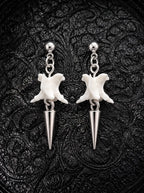 Spire Chain snake bone earrings with short silver-tone spike drops and ball studs, displayed as a pair on black fabric