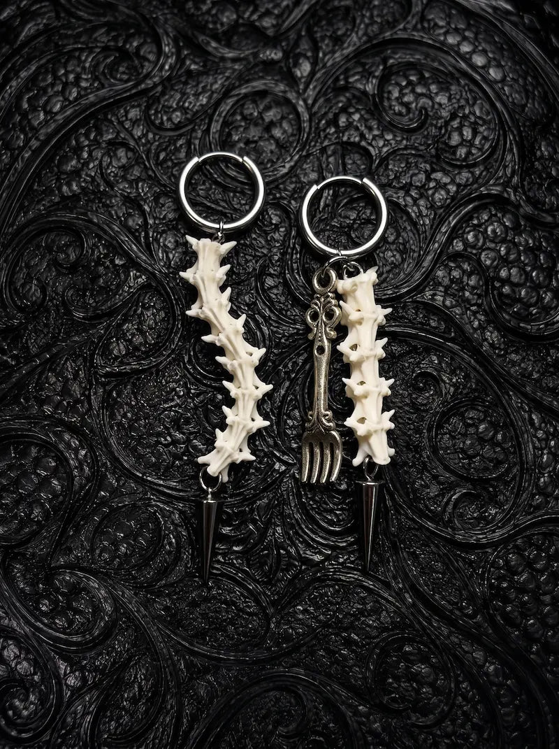 Split Relic Snake Bone Earrings, matching pale vertebrae earrings with assorted dark silver-tone drop ornaments