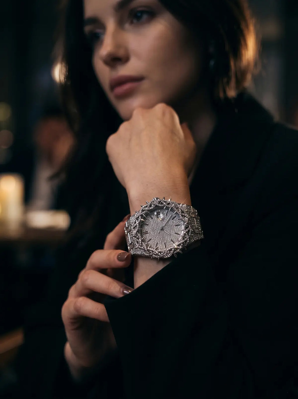 Thorncrown Gothic Watch, pale dial and spiked silver case on a model's wrist near the face