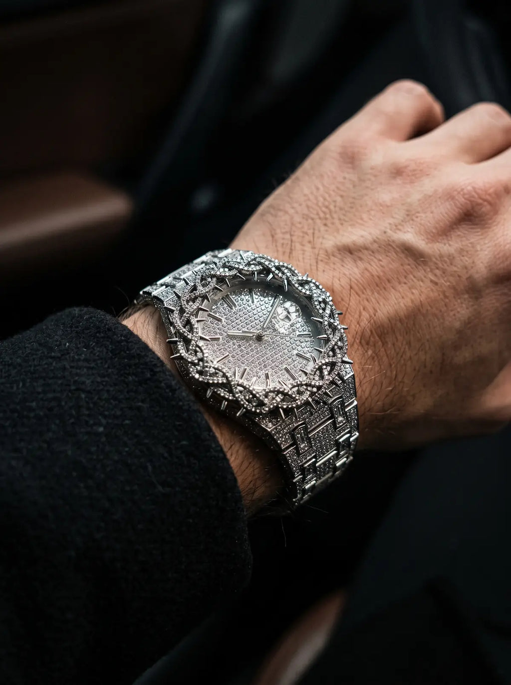 Thorncrown Gothic Watch, close side angle of silver-tone thorn-framed watch worn with a black jacket