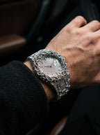 Thorncrown Gothic Watch, close side angle of silver-tone thorn-framed watch worn with a black jacket