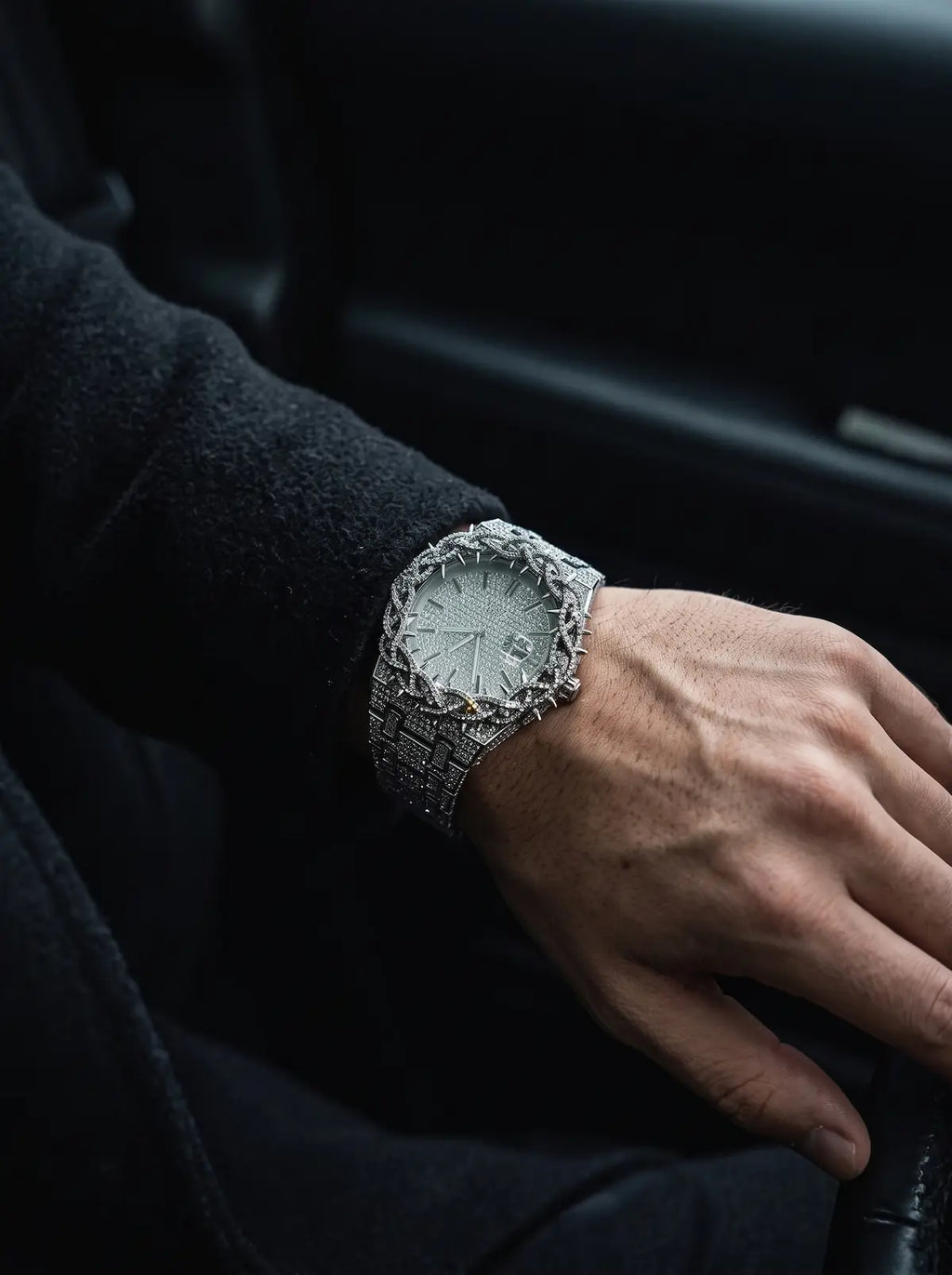 Thorncrown Gothic Watch, silver-tone thorn-pattern watch seen at an angle on a bent wrist