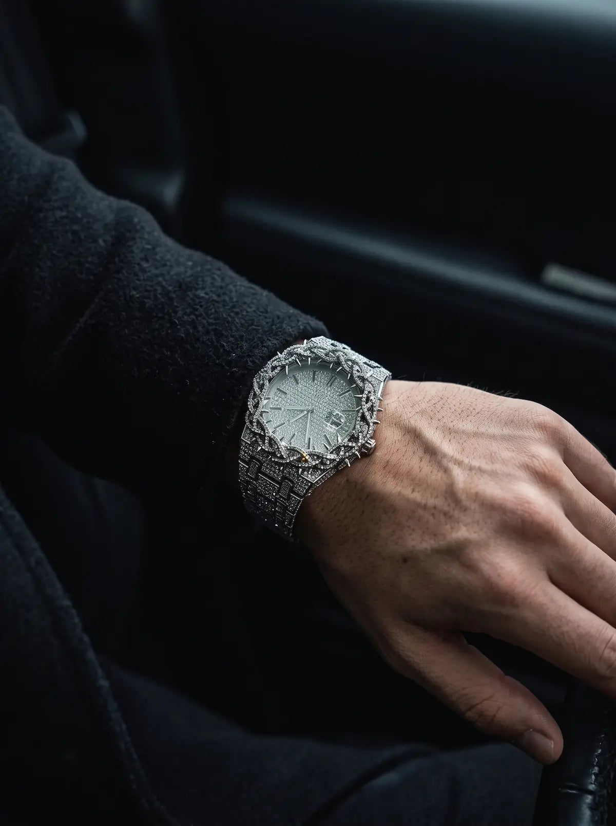 Thorncrown Gothic Watch, silver-tone thorn-pattern watch seen at an angle on a bent wrist