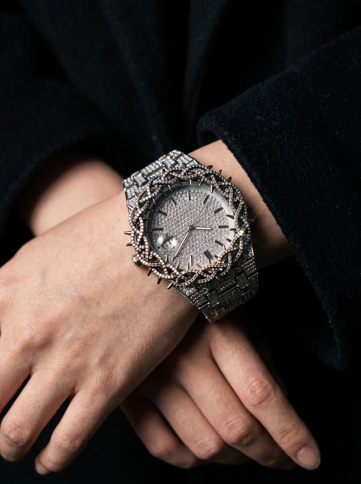 Thorncrown Gothic Watch, front-facing silver watch worn over crossed hands with an ornate metal strap