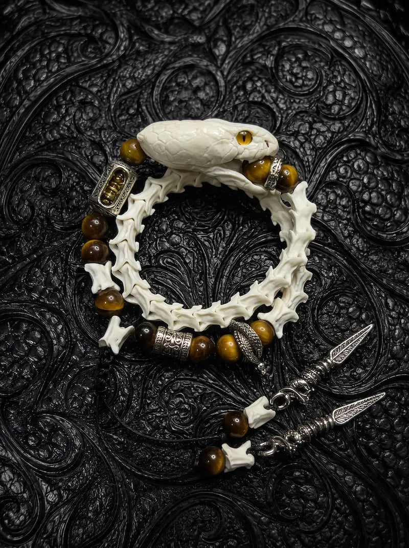 Umberblade Snake Bone Bracelet, pale snake head and vertebrae bracelet with amber-brown beads and metal drops